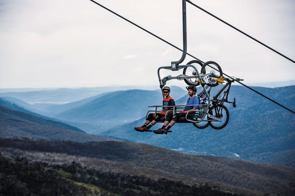 2 people riding a lift